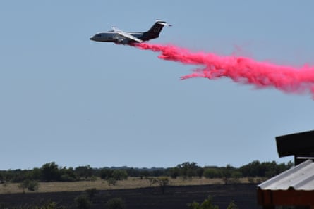 A plane dropped plumes of bright pink liquid.