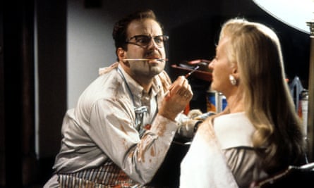 Bruce Willis painting Meryl Streep’s face in a scene from the film Death Becomes Her, 1992.