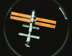 INTERNATIONAL SPACE STATIONThe International Space Station’s solar arrays are aglow against the darkness of space after undocking from Discovery Sunday, March 18, 2001. This view is from the Discovery’s docking port television camera. (AP Photo/NASA TV)