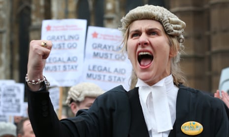 A barrister demonstrates in support of legal aid