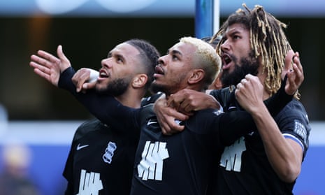 Juninho Bacuna (centre) and his Birmingham City teammates celebrate after he opened the scoring at Queens Park Rangers.