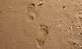Bare human steps<br>Steps of bare human feet on wet sand of sea beach