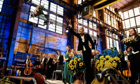 Keri-Lynn Wilson throws a bouquet at the Ukrainian Freedom Orchestra’s concert at Baltic Opera festival in Gdynia shipyard on 23 July 2024.