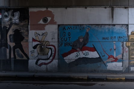 A street mural with the caption ‘Iraq for Iraqi people’.