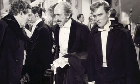 John Fraser, right, as Bosie in The Trials of Oscar Wilde, 1960, with Peter Finch, left, as the playwright and Lionel Jeffries as Bosie’s father, the Marquess of Queensberry.