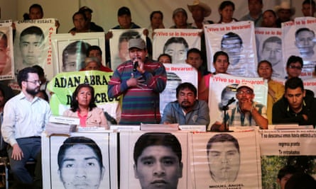Melitón Ortega (centre), the uncle of a student from Ayotzinapa teacher training college, with other relatives of the missing.