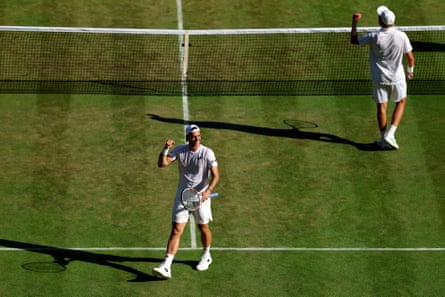 Julian Cash (left) and Lloyd Glasspool observe winning nan men’s doubles semi-final against Marcel Granollers of Spain and Horacio Zeballos of Argentina.