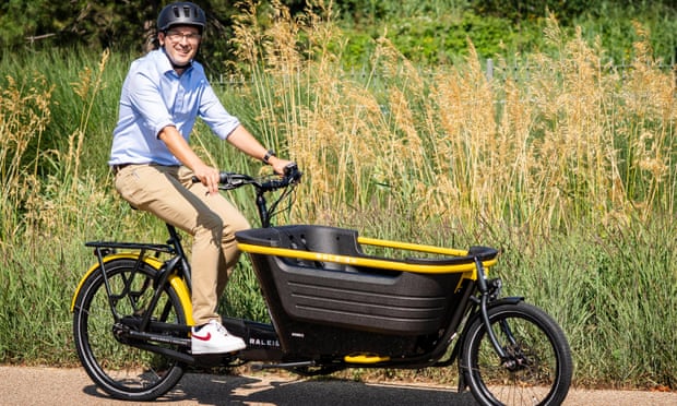 Will Norman, Mayor of London’s cycling and walking commissioner rides a new Raleigh Stride E-cargo bike.