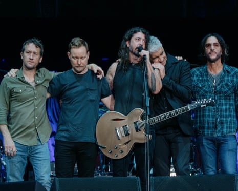 The Foo Fighters looking grave on stage at Wembley Stadium