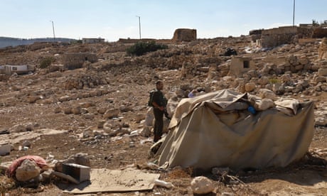 Israeli reservist soldiers in and abandoned Palestinian village