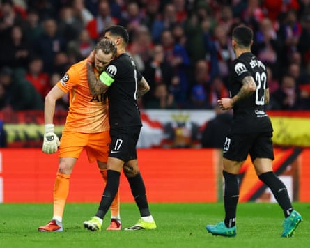 Tottenham Hotspur’s Antonin Kinsky with Cristian Romero after being substituted