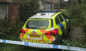A police cordon placed behind houses at Evesham Street in Enfil, northern London, after the attack.