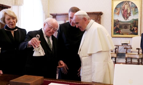 Michael D Higgins and wife Sabina Coyne presents the pope with a ‘climate bell’.