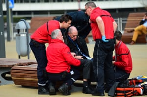 A victim receives first aid by rescuers near Maalbeek metro station.