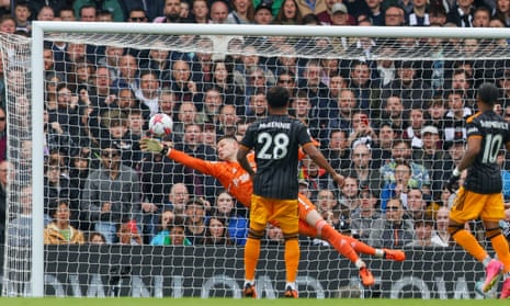 Leeds United goalkeeper Ilan Meslier scores with Fulham's Tosin Adarabioyo's header.
