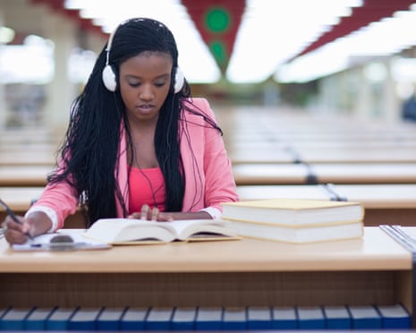 Female student studying in library.