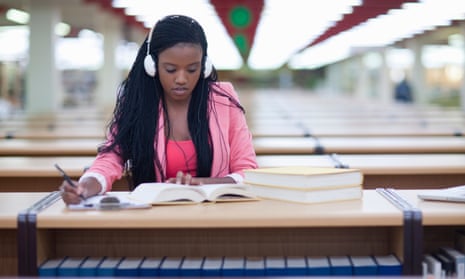 Female student studying in library.