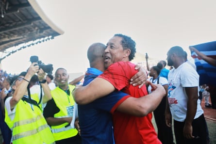 Bubista (right), the Cape Verde head coach, hugs a colleague.
