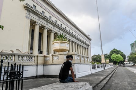 A man sitting in the Liwasang Bonifacio plaza in central Manila