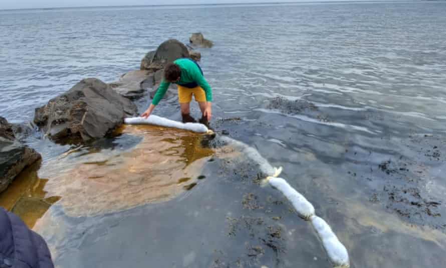 Hair-booms being used to prevent an oil spill from spreading.