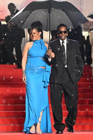 Rihanna and A$AP Rocky with brolly leaving the Highest 2 Lowest red carpet on 19 May