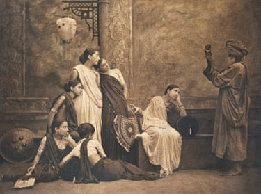 A sepia photograph, titled The Mystic Sign, shows women in saris watching a turbaned man gesture