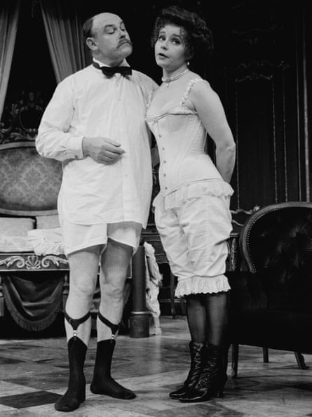 West with his wife Prunella Scales in their underwear in a scene from Big in Brazil at the Old Vic in London in 1984.