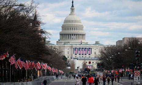 People walk down Pennsylvania Avenue near the US Capitol on 17 January. 