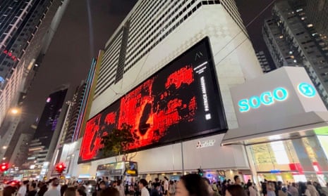 Patrick Amadon's No Rioters digital artwork on the billboard of the Sogo shopping mall in Hong Kong.