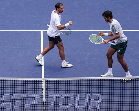 Francisco Cabral and JJ Tracy celebrate with fist pumps during a doubles final