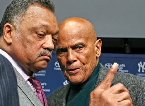 Jesse Jackson talks with legendary singer and civil right rights activist Harry Belafonte after a news conference in New York in 2014.