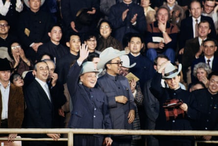 Deng Xiaoping wearing a large white cowboy hat