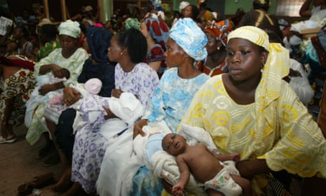 Women and babies wait in a medical centre in Nigeria