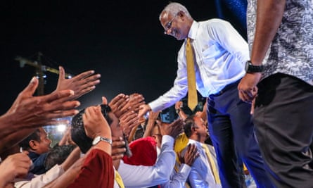 Main opposition leader Ibrahim Mohamed Solih greets a crowd at a rally in the Maldives capital Malé.