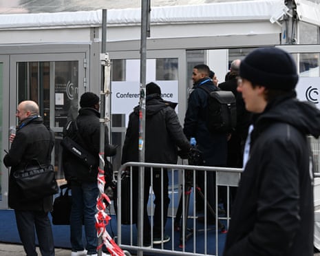 People line up at a security check to enter the Hotel Bayerischer Hof, venue of the Munich Security Conference (MSC) in Munich, southern Germany.