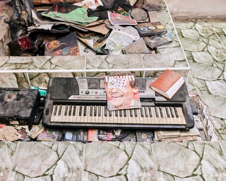 Books, records, videos and equipment beneath paving flags, possibly at Black Ark in Jamaica