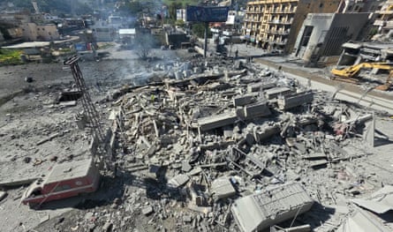 An ambulance amid the rubble of destroyed buildings in Nabatieh.