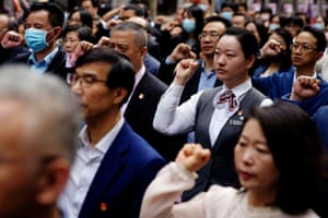 People recite the party oath during an event marking the 100th founding anniversary of the Communist Party of China at the Memorial of the First National Congress of the Communist Party of China in Shanghai,