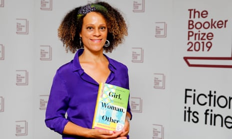 British author Bernardine Evaristo poses with her book Girl, Woman, Other.