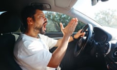 Angry screaming male driver driving car.