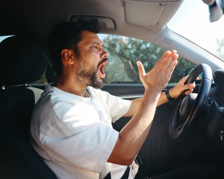 young man getting angry in a car