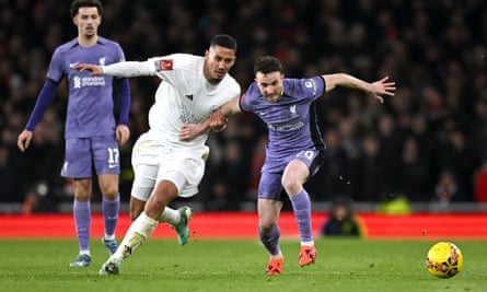 Arsenal's William Saliba challenges Diogo Jota of Liverpool.