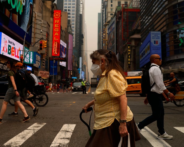 ‘My eyes were stinging’: New Yorkers navigate smoky air and soaring temperatures