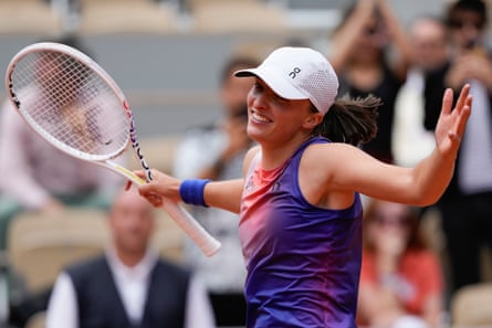 Iga Swiatek celebrates after winning her 2024 French Open quarter-final match against Marketa Vondrousova.