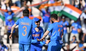 India’s Mohammed Shami (right) celebrates with teammates Rohit Sharma (centre) and Yuzvendra Chahal (left) after his hat-trick and victory.