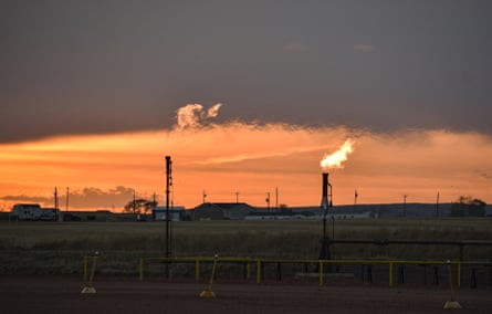 Flaring, burning natural gas from oil production, in North Dakota, 18 May 2021.