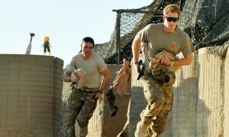 Prince Harry (right)  racing out from tent to scramble his Apache with fellow Pilots in Afghanistan