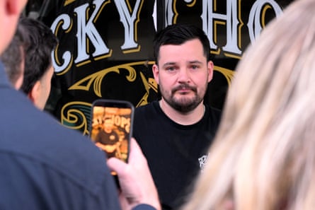 Barber Ricky Jefferies speaks to the media on Tuesday a day after tackling a man who attacked Helen Haines.