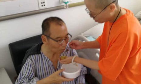 Liu Xiaobo is attended to by his wife Liu Xia in a hospital in China. 