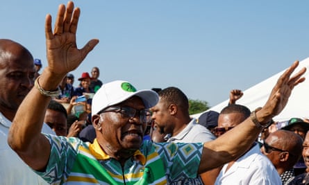 Jacob Zuma gestures with his hands in the air